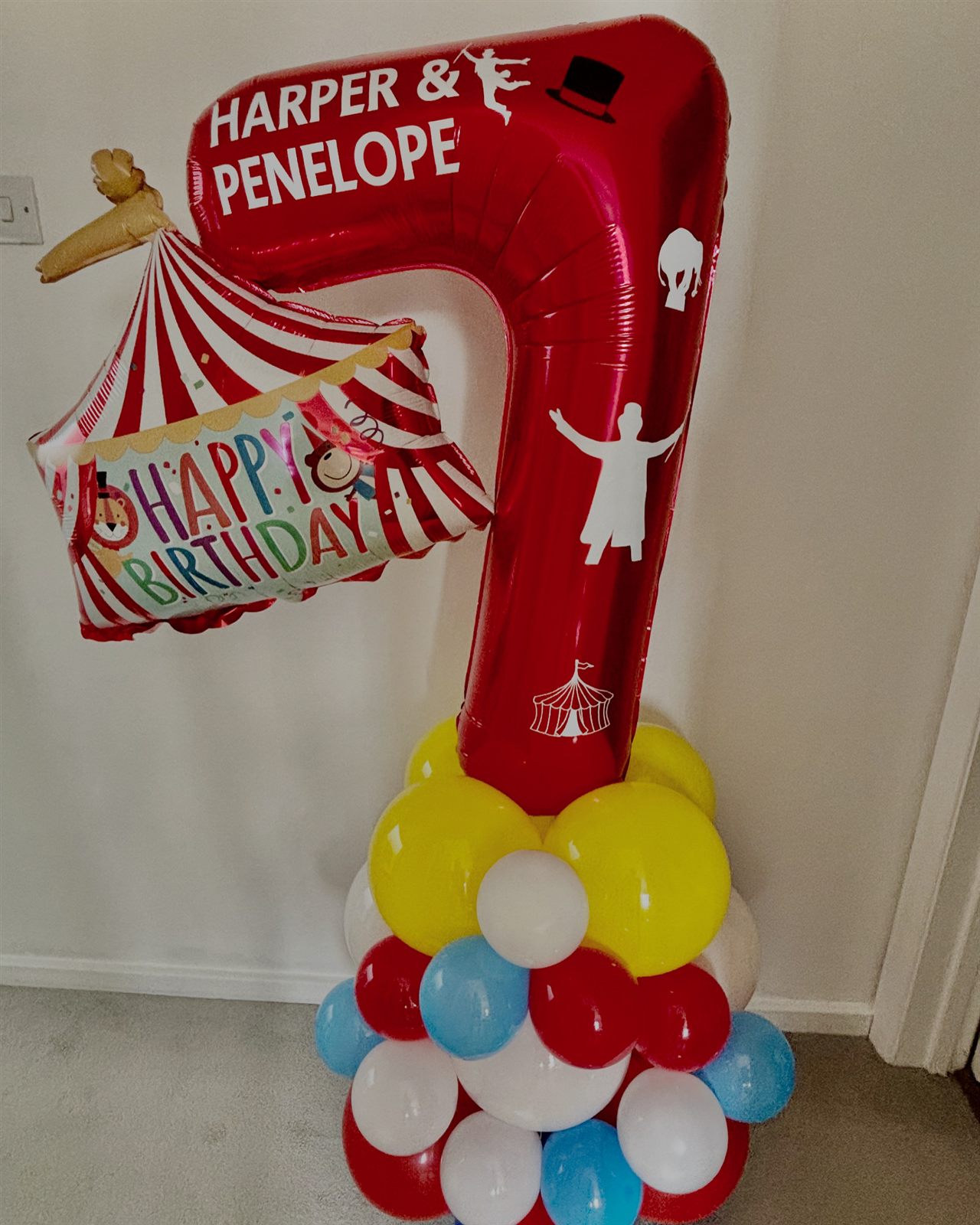 Circus themed red number 7 balloon stack