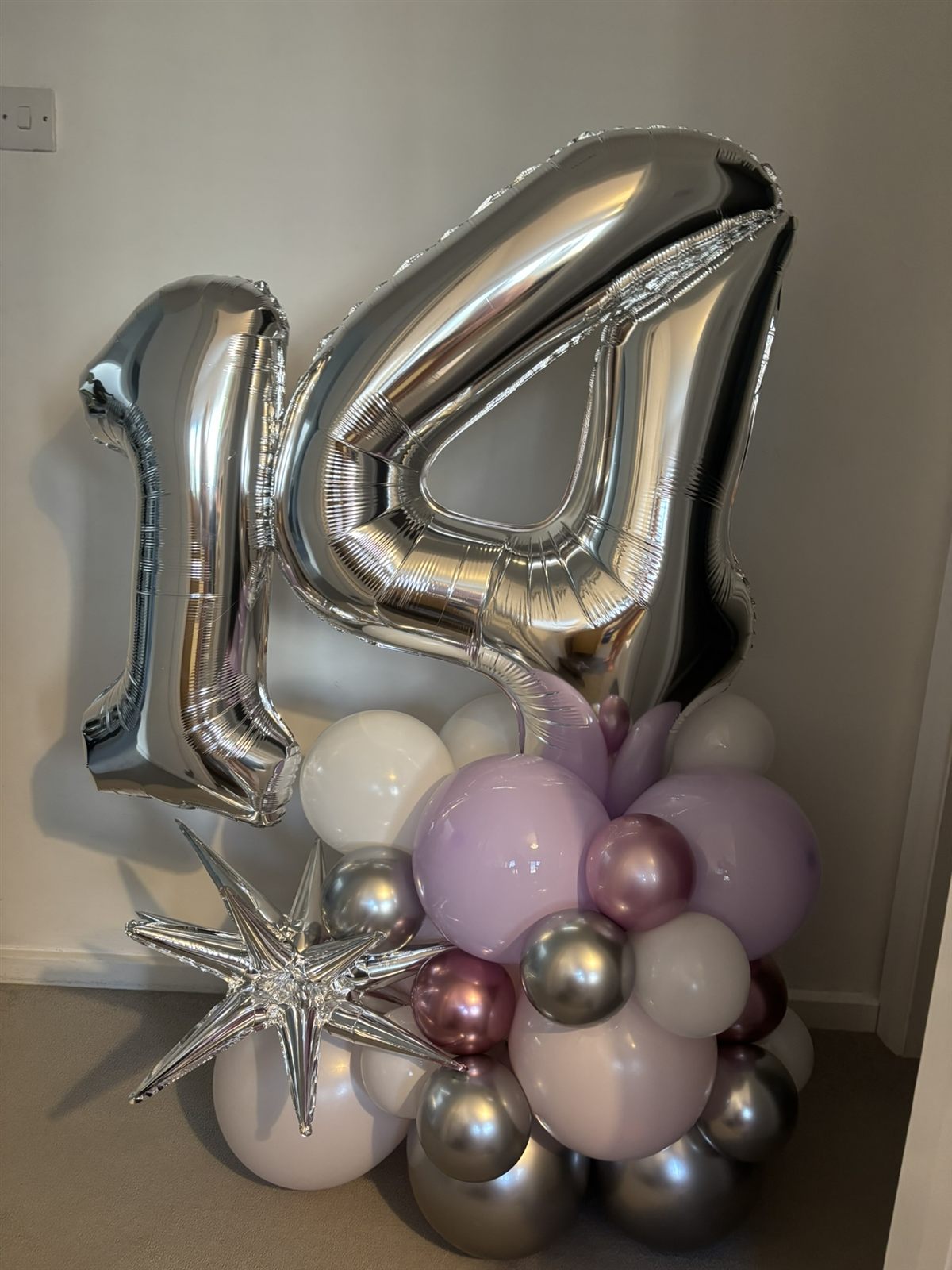 Silver number 14 balloon stack with lilac base and starburst